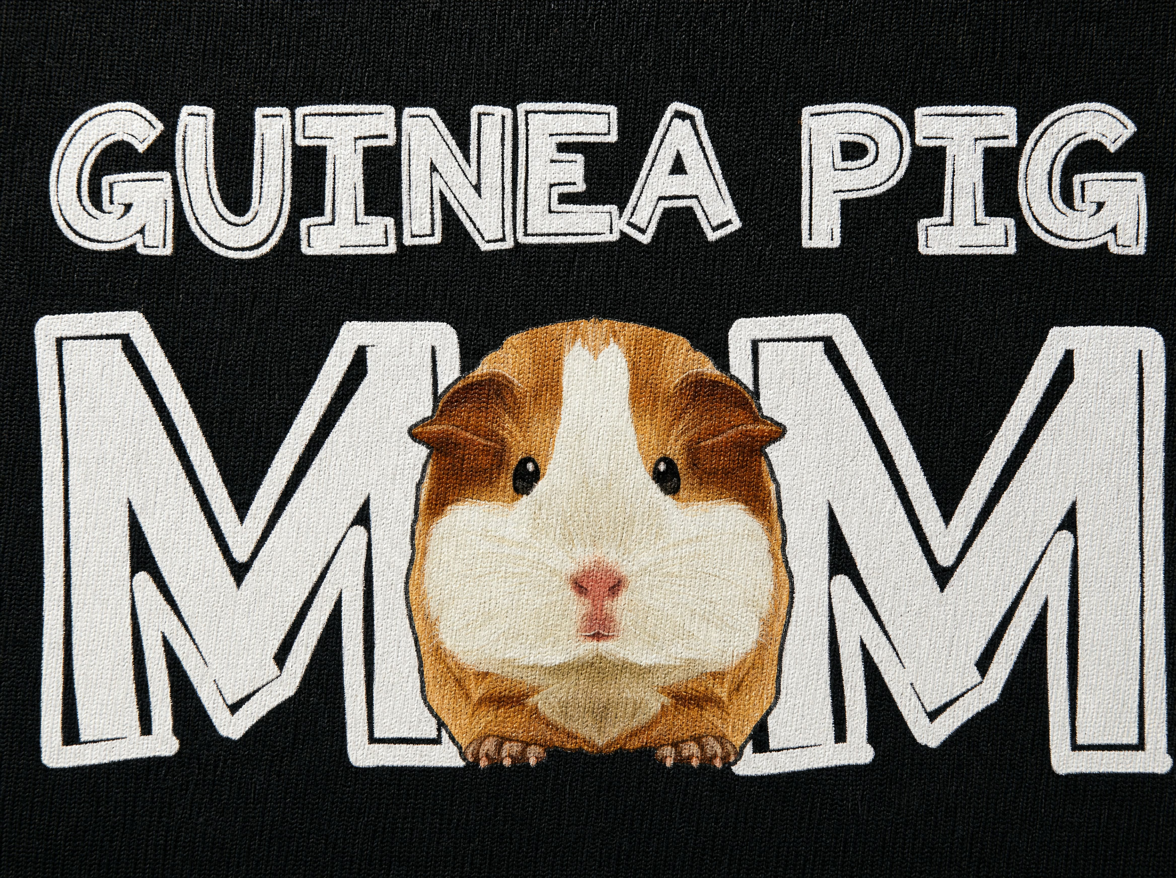 Macro detail of the Guinea Pig Mom print showing the cotton weave and the guinea pig in the O